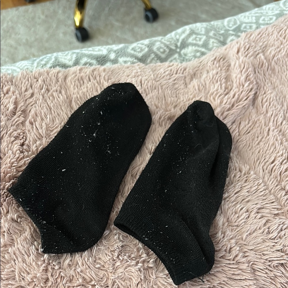 Very well worn black socks
